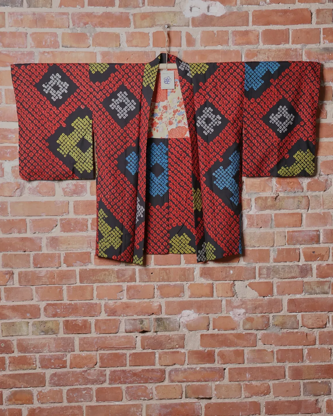 Red-black haori with colourful geometric motifs — view 1