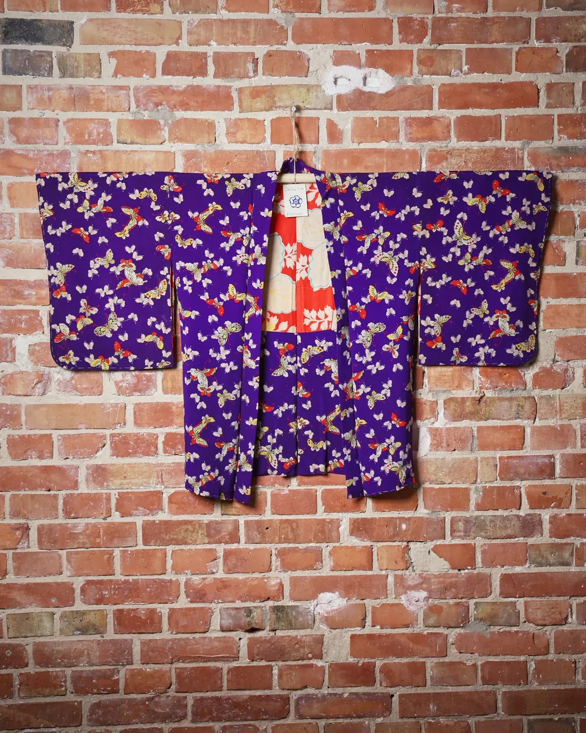 Purple butterfly haori with a red floral lining — view 1