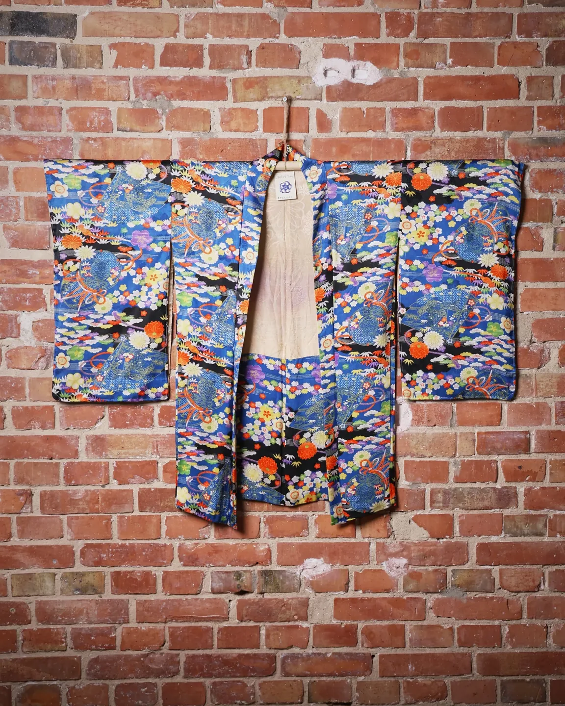 Blue jacket with a multicoloured floral pattern — view 1