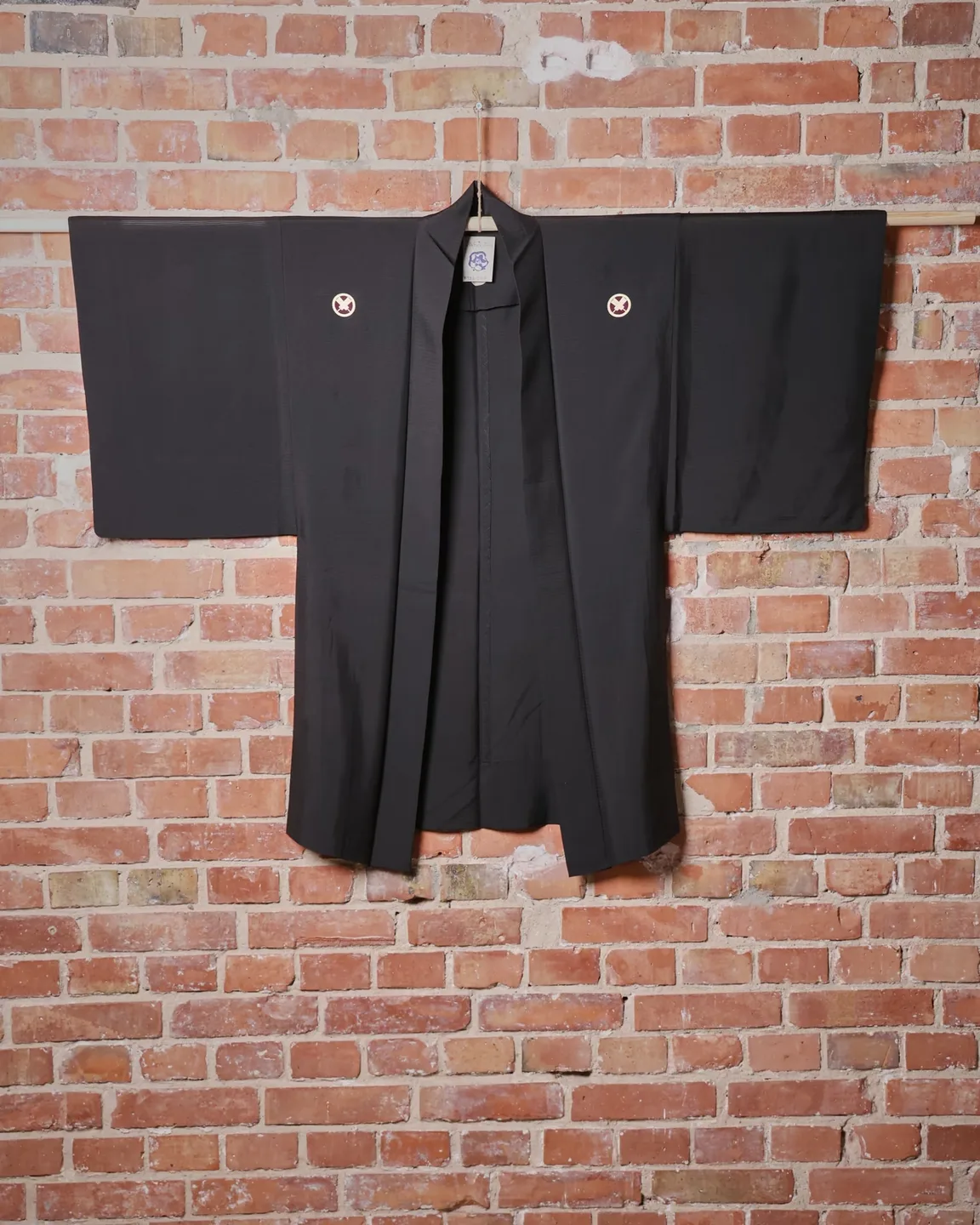 Black jacket with contrasting round crests — view 1