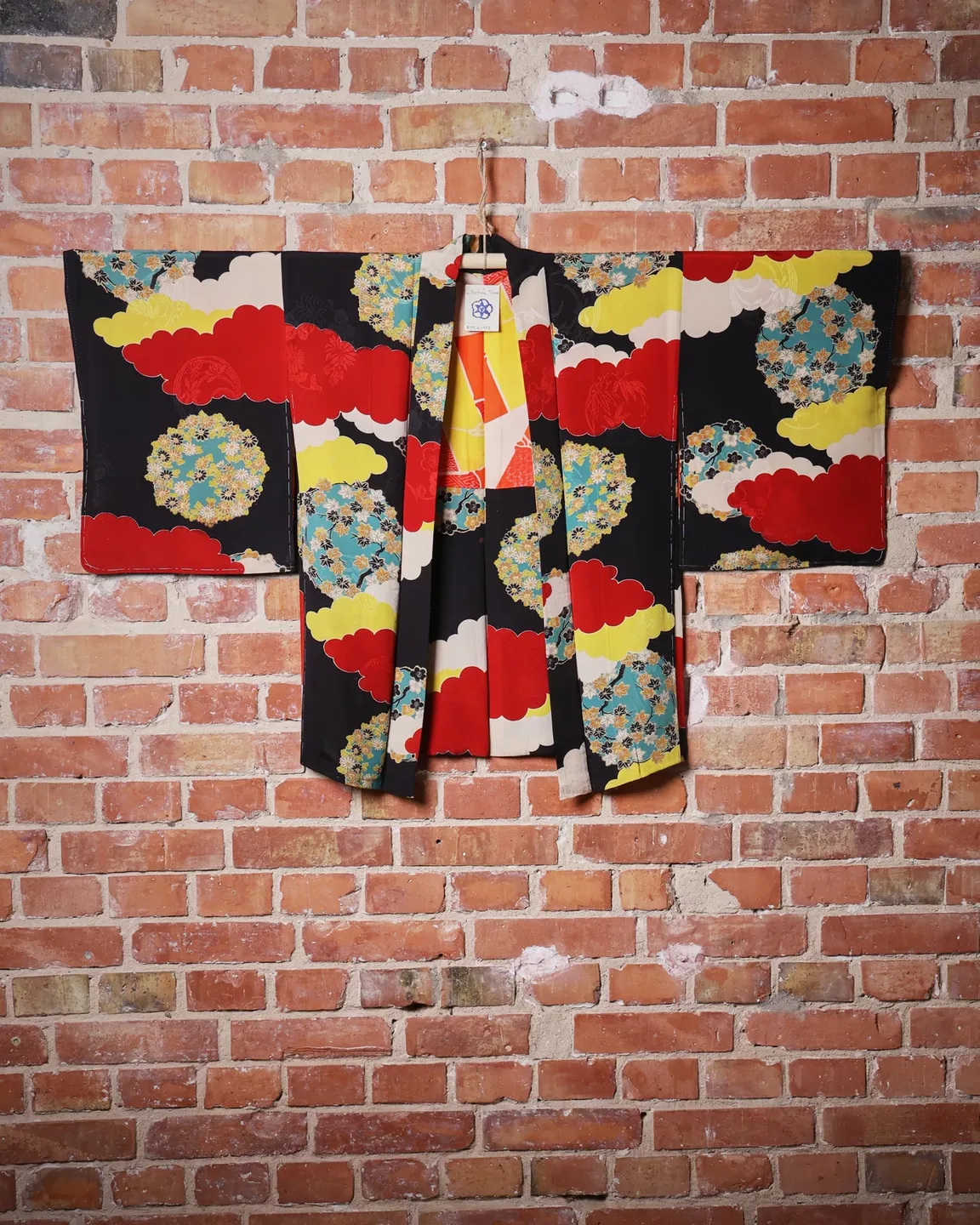 Black haori with colourful clouds and floral circles — view 1